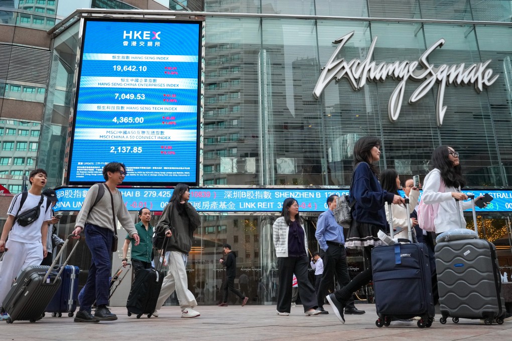 People walk by the Hong Kong stock exchange in Central. Photo: May Tse