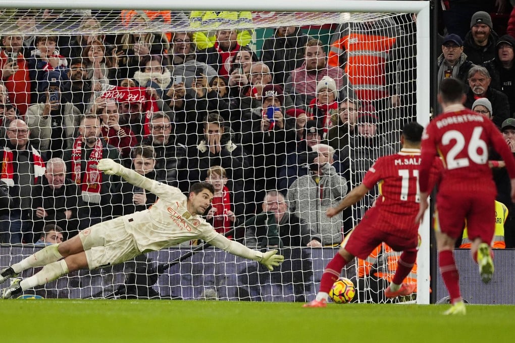 Liverpool’s Mohamed Salah scores from the penalty spot past Manchester City goalkeeper Stefan Ortega. Photo: AP