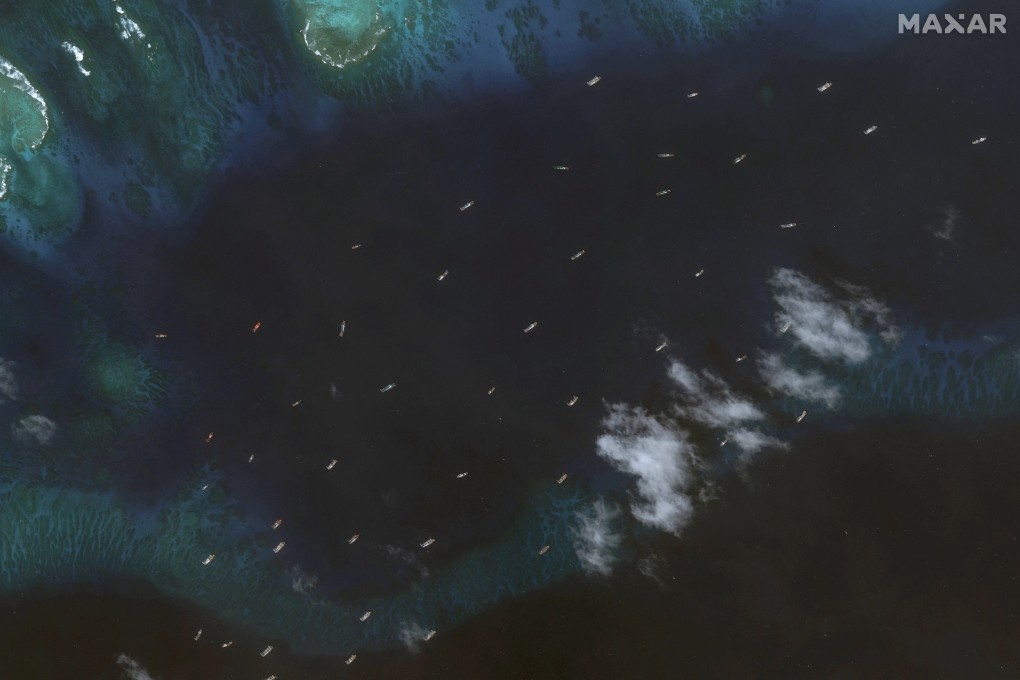A fleet believed to be Chinese maritime militia is seen near Thitu Island in a satellite image taken on November 25. Photo: Maxar Technologies/Handout via Reuters
