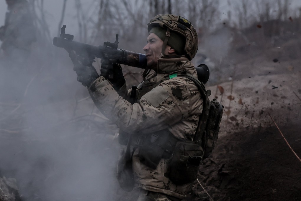 A Ukrainian soldier fires a weapon during a drill in the Donetsk region, eastern Ukraine. Photo: 24th Mechanised Brigade Press Service via EPA-EFE