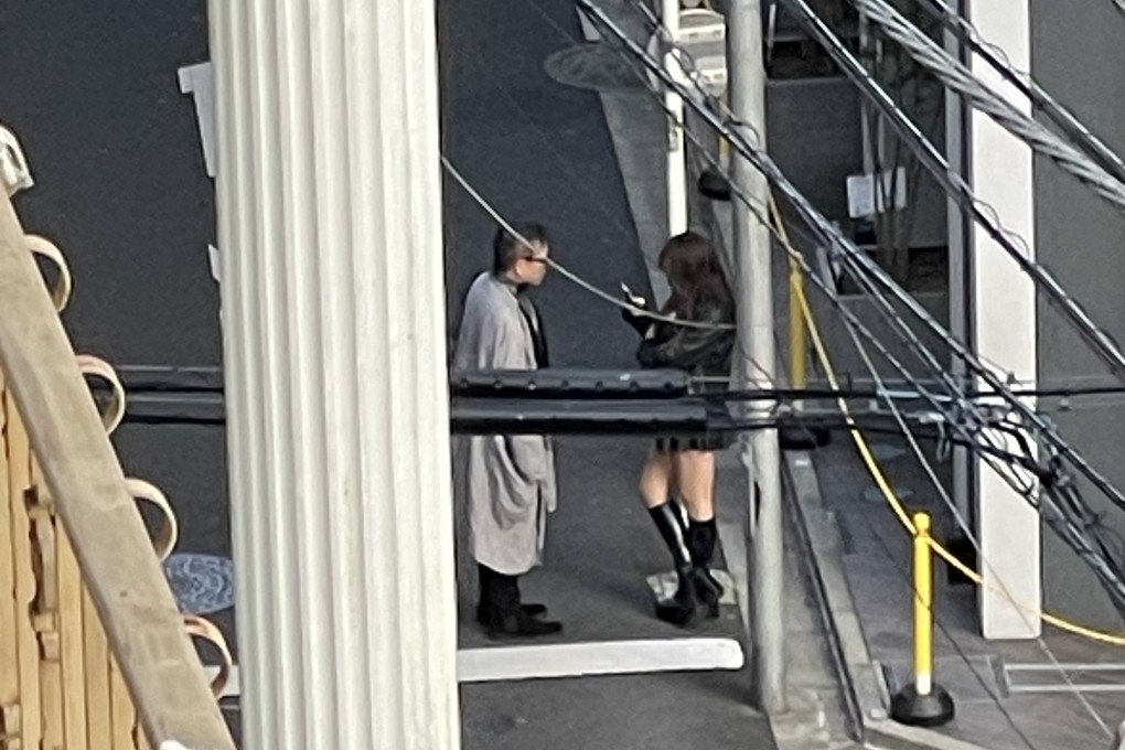 A man approaches a woman near Okubo Park in Tokyo’s Kabukicho district, presumably to solicit sexual services. Photo: Eric Fior
