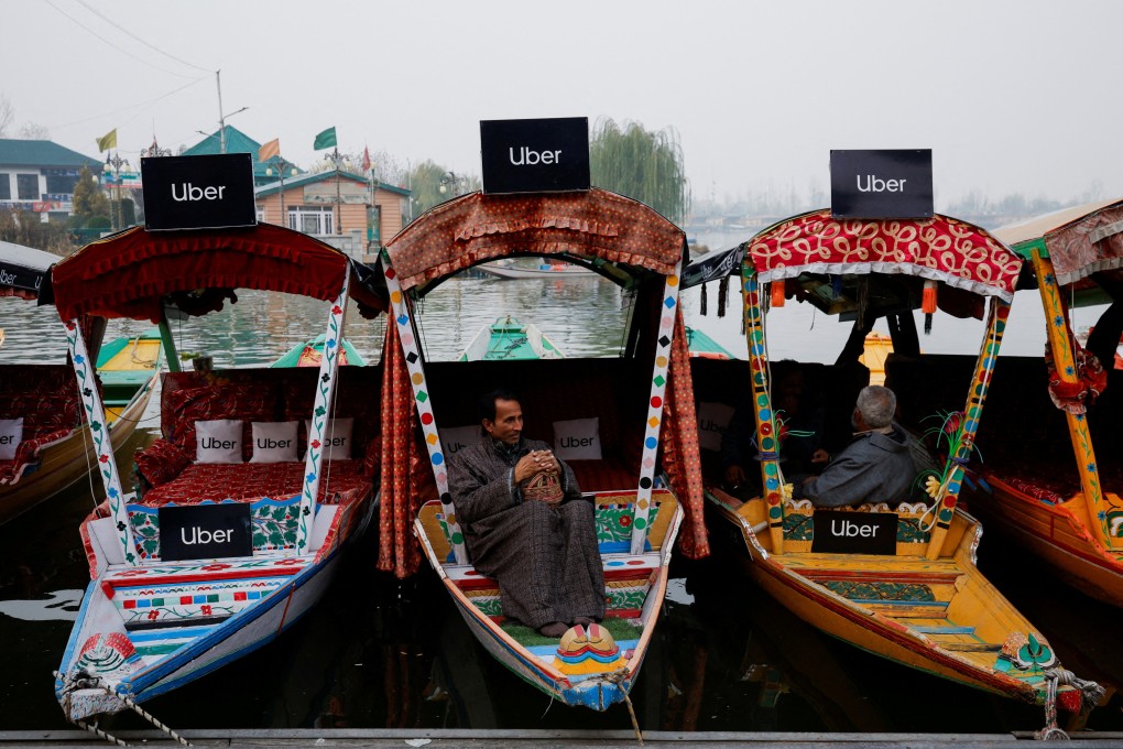 Uber signs on shikaras  after Uber launched its first water transport service on the waters of Dal Lake, one of Kashmir’s main tourist attractions, in Srinagar, India. Photo: Reuters