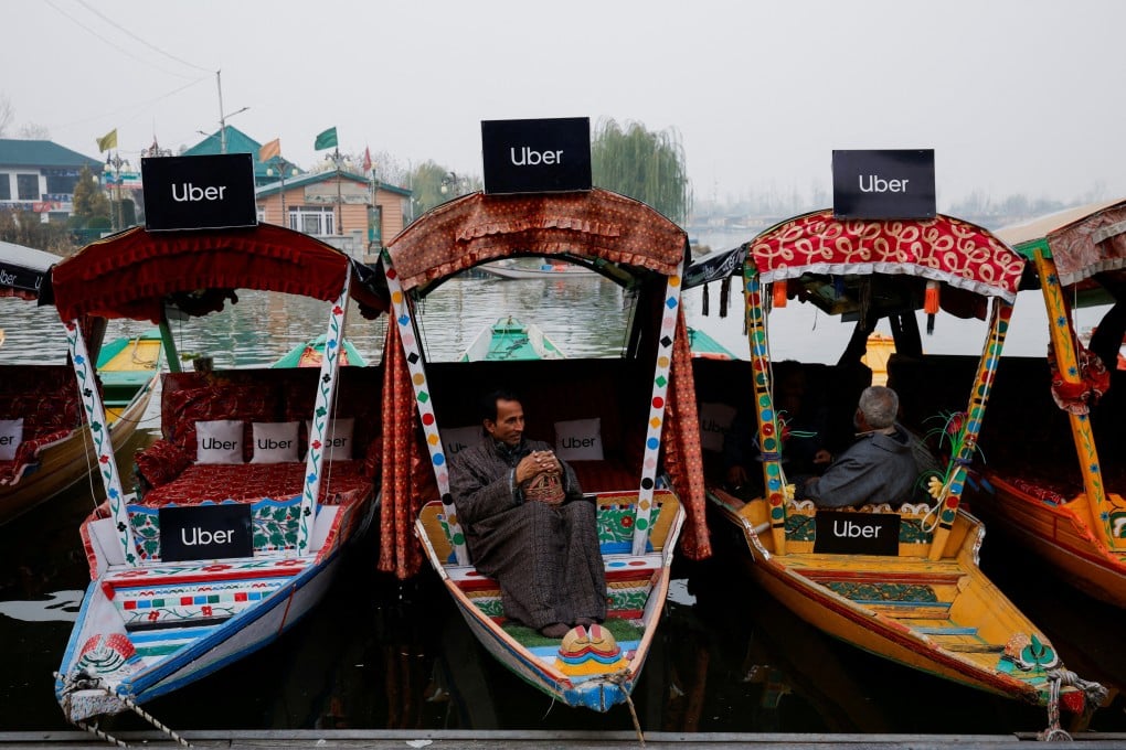 Uber signs on shikaras after Uber launched its first water transport service on the waters of Dal Lake, one of Kashmir’s main tourist attractions, in Srinagar, India. Photo: Reuters