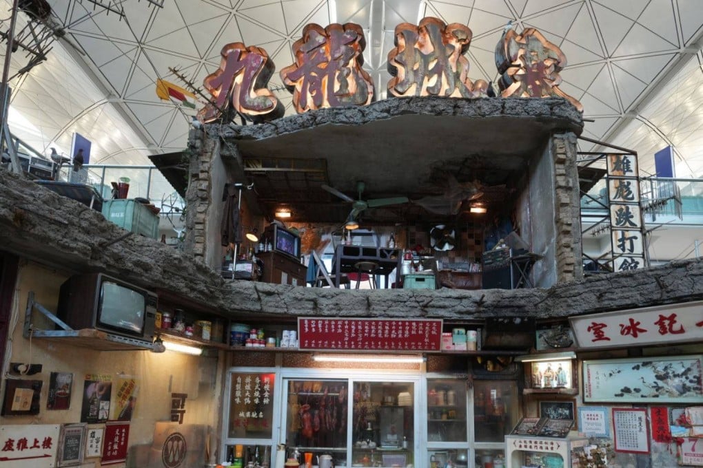 The exhibit features a 6.5-metre-high double-storey set and a large “Kowloon Walled City” neon sign. Photo: Sam Tsang