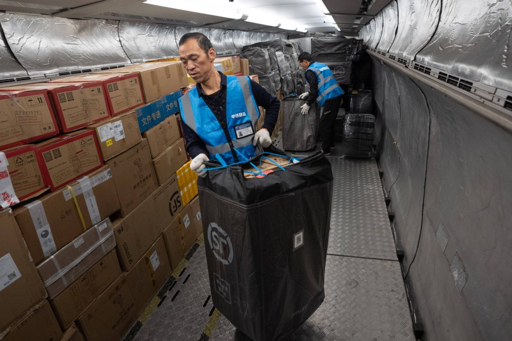Workers unload e-commerce parcels from a bullet train at Shuangliu West Railway Station in Chengdu, southwest China’s Sichuan province. Photo: Xinhua