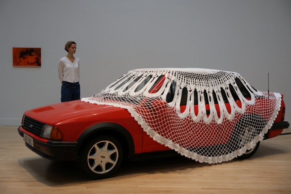 A gallery assistant poses with Jasleen Kaur’s installation at the Tate Britain in London in September. Photo: Reuters
