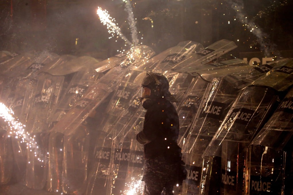 Police officers use shields as supporters of Georgia’s opposition parties protest in Tbilisi. Photo: Reuters