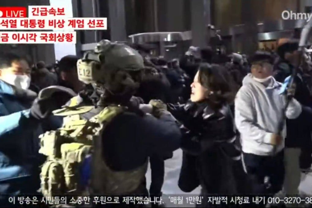Ahn Gwi-ryeong tussles with a South Korean soldier in Seoul on Tuesday. Photo: X/youlu_v0v