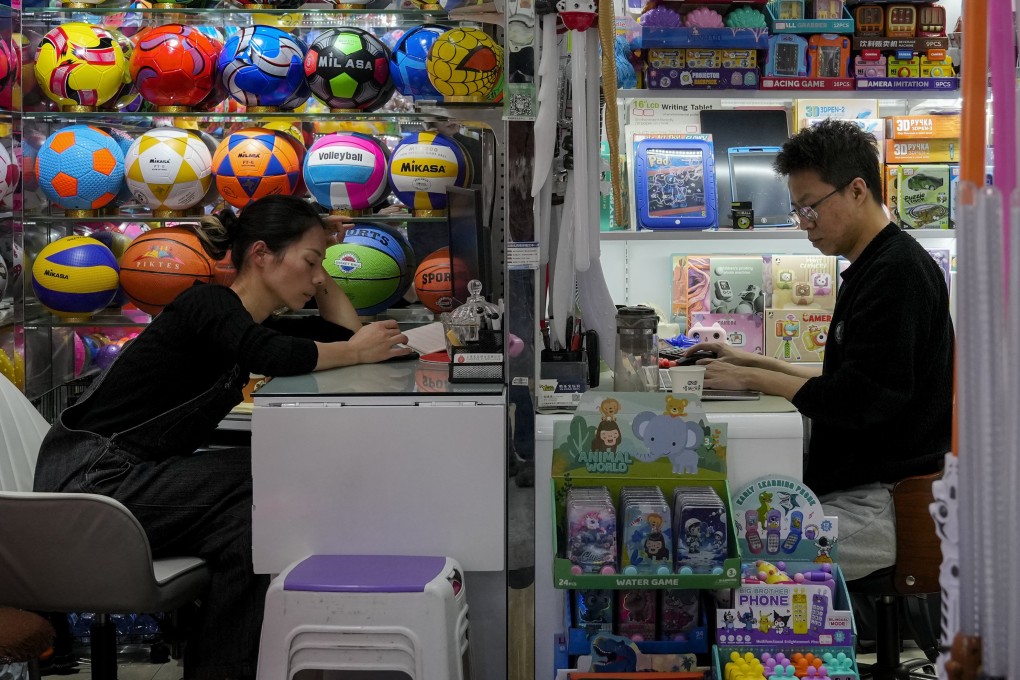 Vendors wait for customers at their stores selling toys at the Yiwu wholesale market in Yiwu, in east Zhejiang province, on November 8. Photo: AP