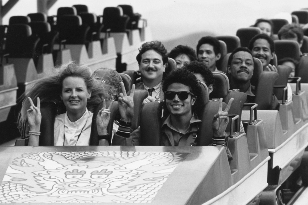 Michael Jackson, his minders and other visitors taking a roller coaster ride at Ocean Park during the pop superstar’s private trip to Hong Kong in 1987. Entertainer Dr Penguin (with moustache) sits behind him. Photo: SCMP