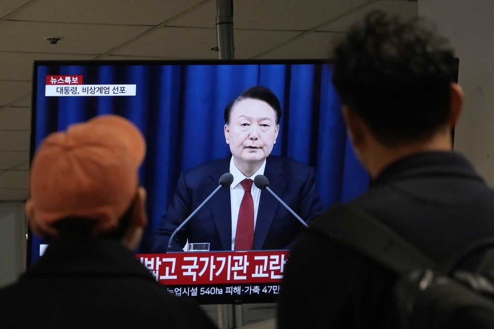 People watch as South Korean President Yoon Suk-yeol declares martial law during a televised briefing in Seoul on December 3, 2024. Photo: AP