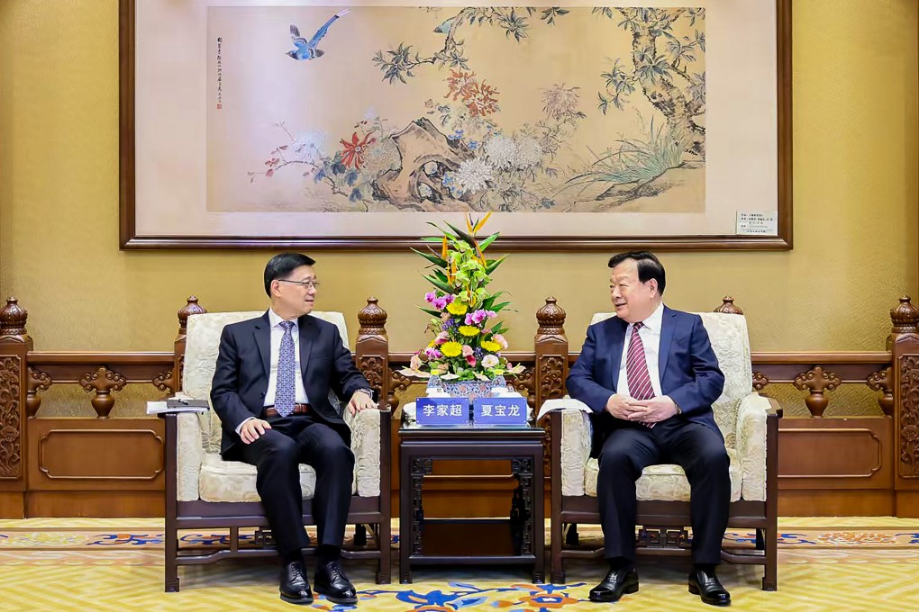 Senior Beijing official Xia Baolong (right) meets Hong Kong Chief Executive John Lee in Beijing. Photo: Hong Kong and Macau Affairs Office