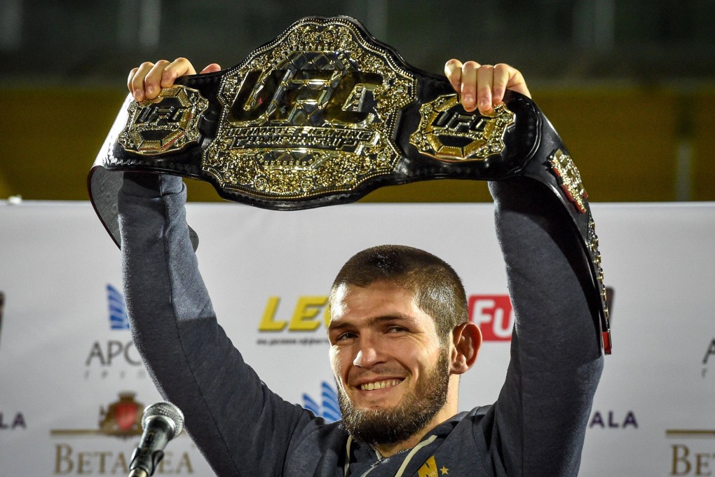 UFC lightweight champion Khabib Nurmagomedov of Russia raises his champions belt in the city of Makhachkala in 2018. Photo: AFP