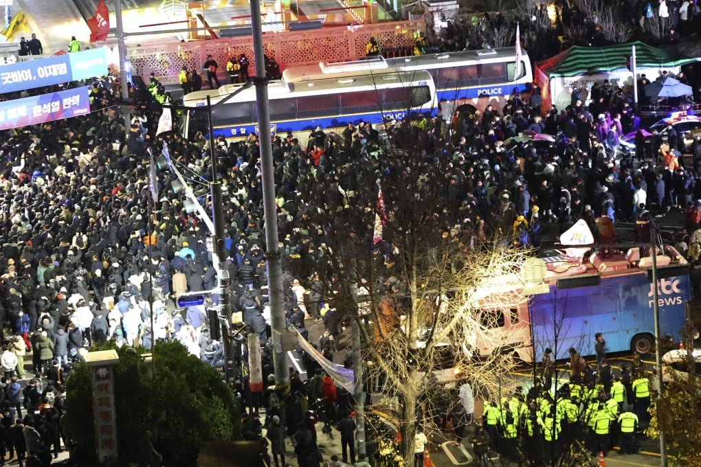 South Koreans gather to demand President Yoon Suk-Yeol step down in front of the National Assembly in Seoul on December 4, 2024. Photo: Yonhap via AP