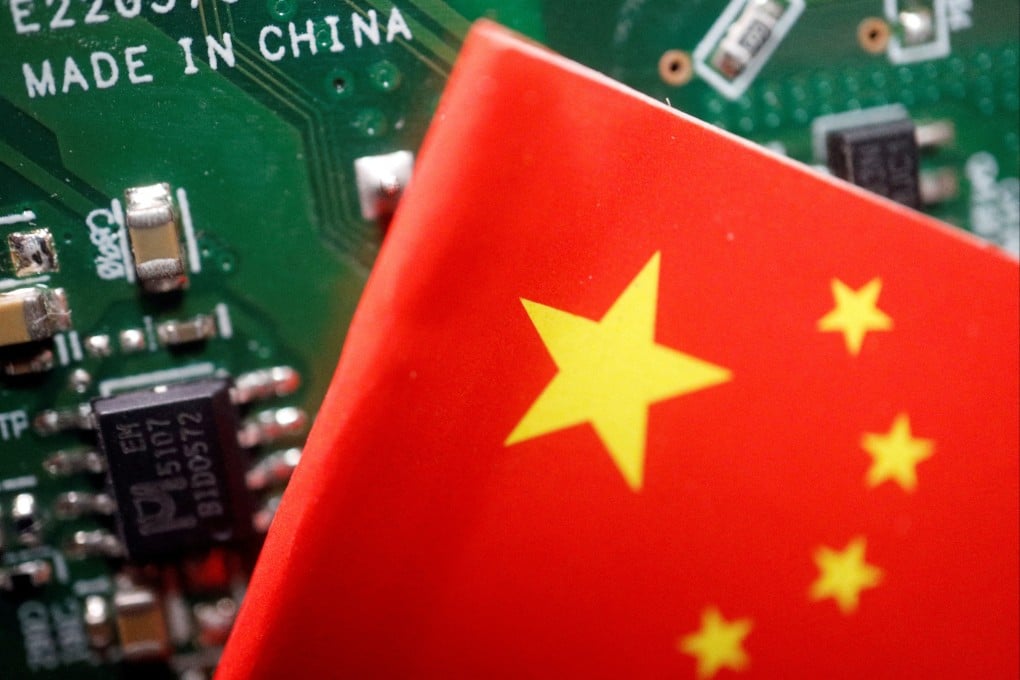A Chinese flag is displayed next to a ‘Made in China’ sign on a printed circuit board, in this illustration picture taken February 17, 2023. Photo: Reuters