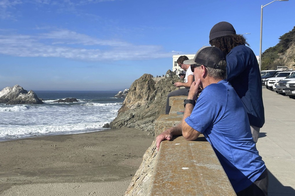 People watch the waves come in after an earthquake was felt widely across northern California, at Ocean Beach in San Francisco on Thursday. Photo: AP