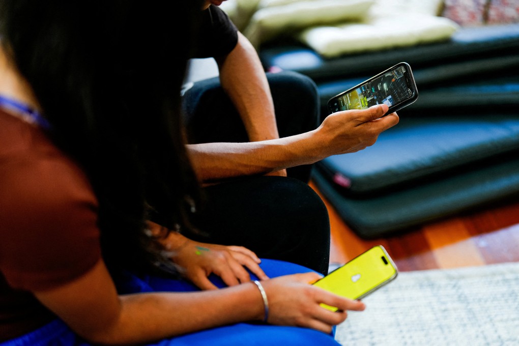 School students in Melbourne use social media applications on their smartphones. Photo: Reuters