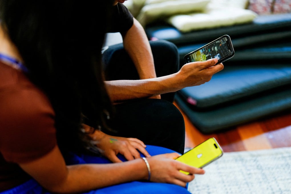 School students in Melbourne use social media applications on their smartphones. Photo: Reuters