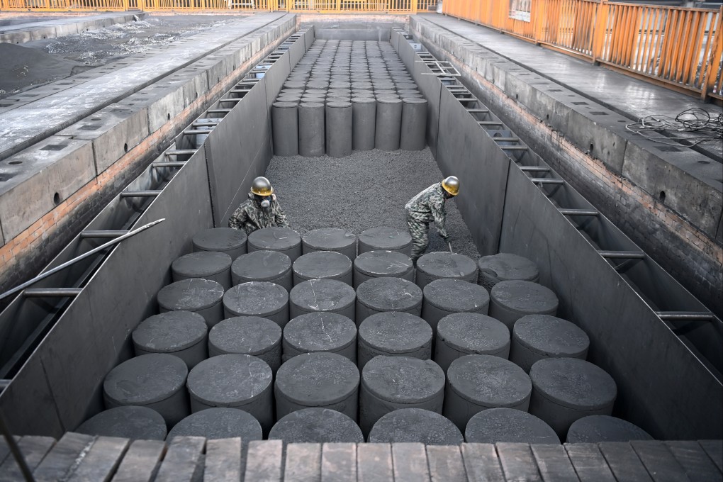 Employees of Lanzhou Hongbin New Energy Development work at the graphitization furnace, which heats graphite to high temperatures to improve its physical structure. Beijing placed a stringent review process on exports of the material, used in batteries and fuel cells. Photo: Xinhua
