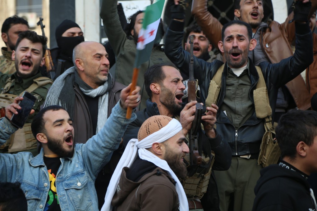 Syrian rebels celebrate following the takeover of Damascus, in Homs, Syria, on December 8, 2024. Photo: EPA-EFE