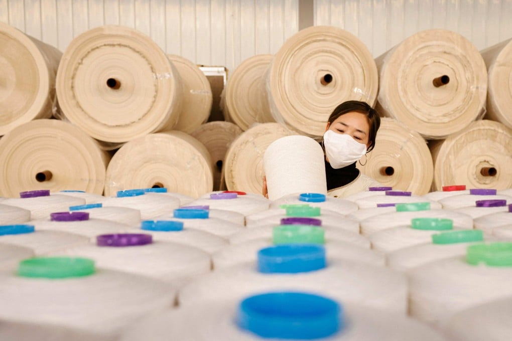 An employee works at a textile factory in Sihong, in eastern China’s Jiangsu province. Photo: AFP