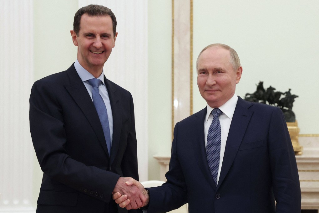 Russia’s President Vladimir Putin (right) shakes hands with his Syrian counterpart Bashar al-Assad during their meeting at the Kremlin in Moscow on July 24,. Photo: Pool/Sputnik