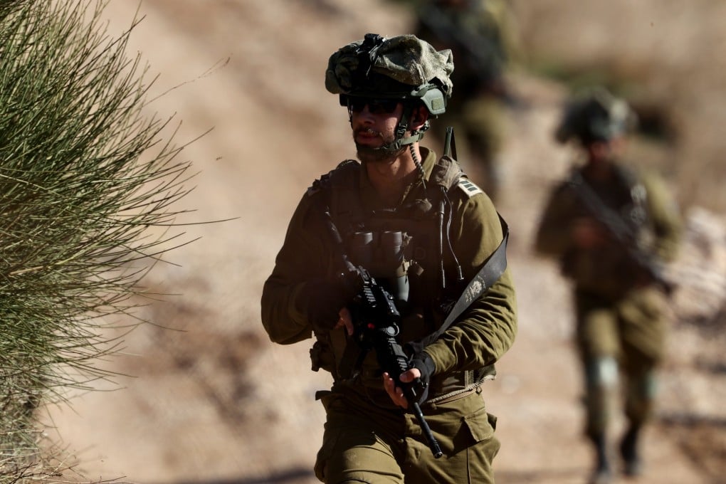 Israeli troops move on the Syrian side of the border near the Druze village of Majdal Shams, in the Israeli-annexed Golan Heights, on December 9. Photo: EPA-EFE