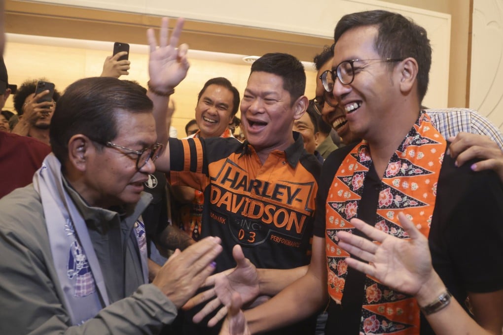 Pramono Anung (left), Jakarta’s next governor, greets supporters at a press conference last month. Photo: EPA-EFE