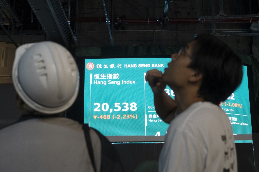 People monitored the markets in Hong Kong. Photo: EPA-EFE