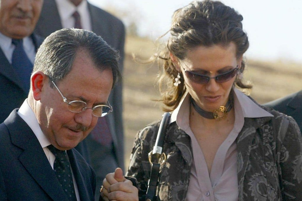 Syria’s first lady Asma al-Assad with her father Fawaz al-Akhras in 2004. File photo: AFP