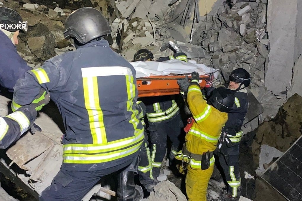 Rescuers carry the body of a person pulled from the rubble of a building that was hit by a Russian missile strike in Zaporizhzhia, Ukraine, on Tuesday. Photo: Press service of the State Emergency Service of Ukraine in Zaporizhzhia region/Handout via Reuters