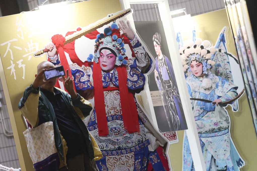 A fan takes a selfie with a cardboard cutout of opera master Lo Ka-ying at the Hong Kong Cultural Centre in Tsim Sha Tsui on June 5. Photo: Jelly Tse