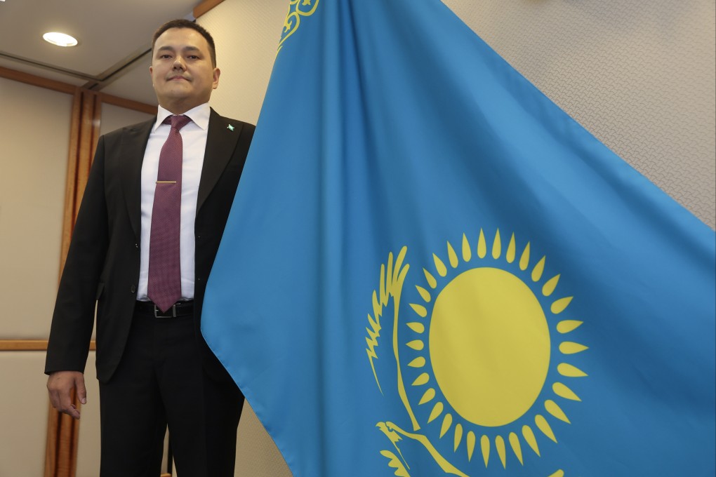 Almas Seitakynov, consul general of Kazakhstan in Hong Kong, poses with his country’s flag, in Central on October 4. Photo: Edmond So