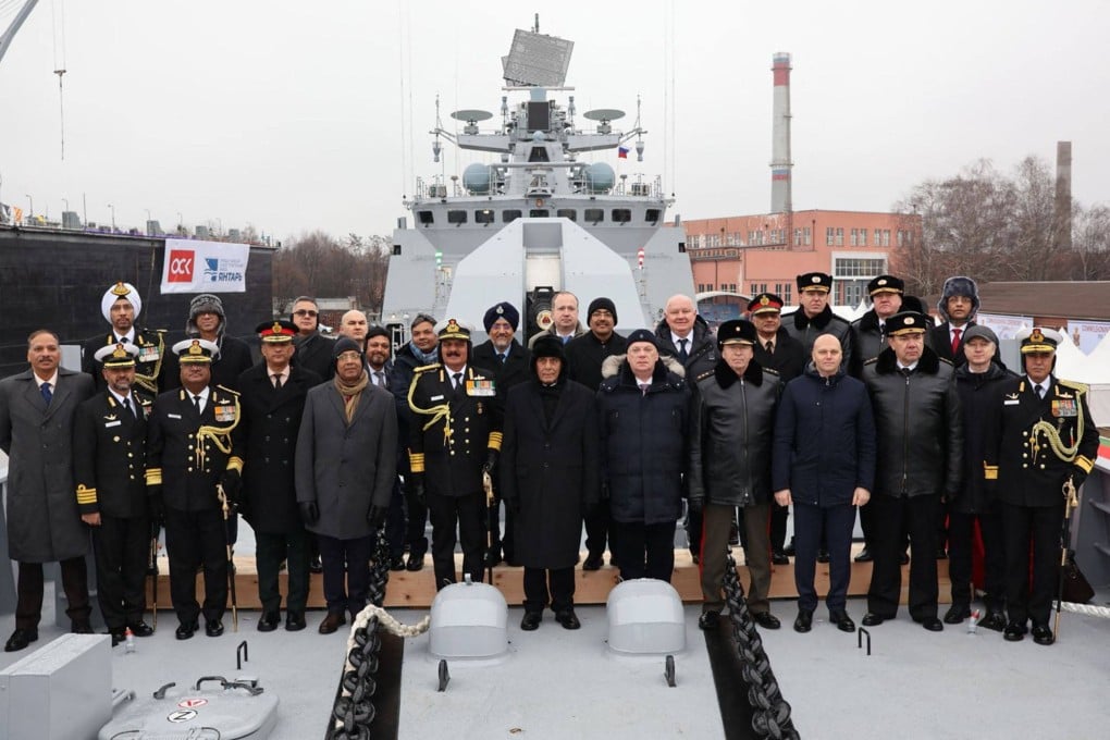 India’s Defence Minister Rajnath Singh (centre) posing for photographs with the Russian delegation during the commissioning ceremony of India’s latest multi-role stealth guided missile frigate. Photo: India’s Ministry of Defence/AFP