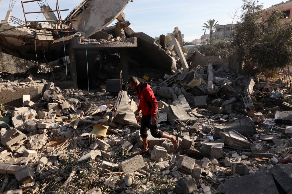 A Palestinian man inspects the site of an Israeli strike on a house, in Nuseirat, central Gaza Strip. Photo: Reuters