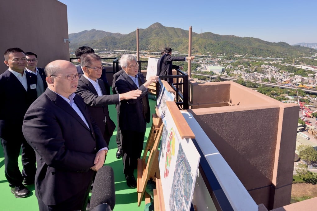 Financial Secretary Paul Chan, centre, leads a delegation during a visit to the Northern Metropolis on November 29. Photo: Handout