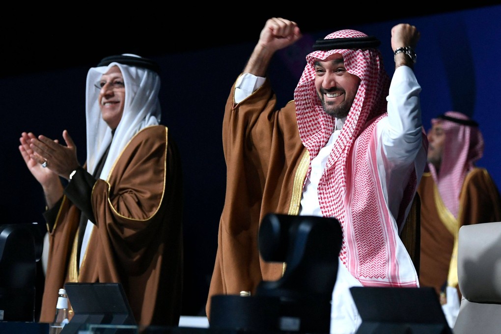 Saudi Arabia’s Minister of Sports and Youth Abdulaziz bin Turki al-Faisal al-Saud (right) celebrates after Saudi Arabia is confirmed as host of the 2034 World Cup. Photo: AFP