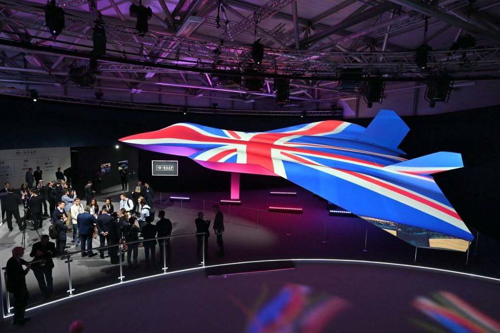 The Global Combat Air Programme’s 6th generation fighter jet concept design, bathed in the colours of the United Kingdom’s national flag, on the opening day of the Farnborough International Airshow in London on July 22. Photo: AFP