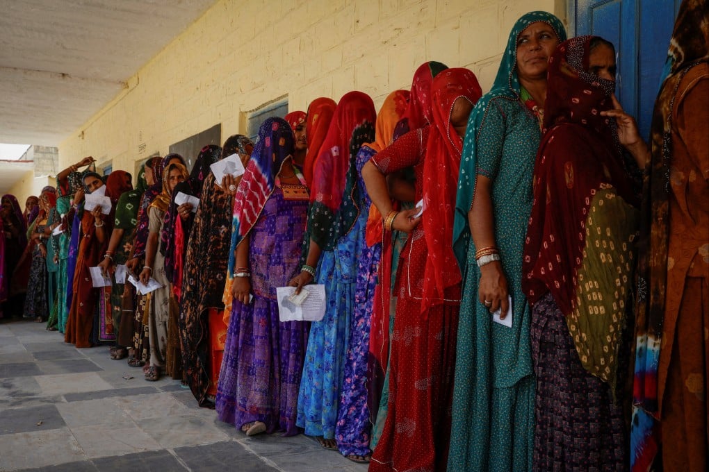 Women stand in a queue to cast their vote at a polling station during the second phase of the general elections, in Barmer, Rajasthan, India, on April 26. Photo: Reuters
