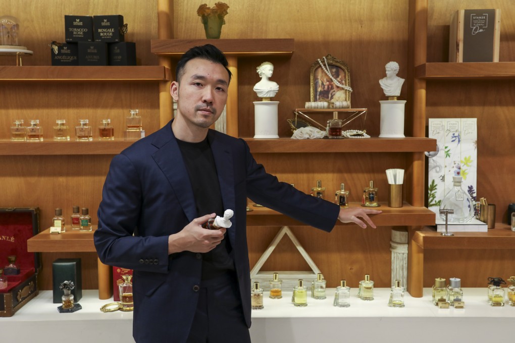 Scented Niche founder Patrick Hui stands in front of a display at the brand’s shop in Causeway Bay’s Fashion Walk, in Hong Kong. Photo: Fan Chen