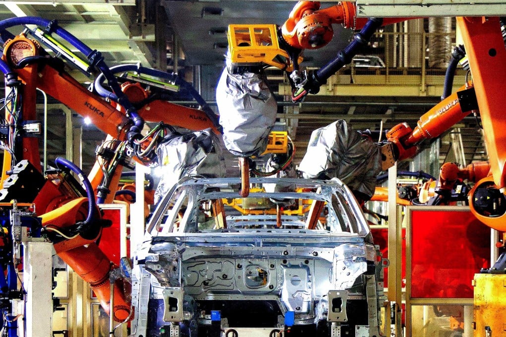 A robot arms working at an automobile assembly factory in Qingdao in eastern China’s Shandong province. Photo: AFP