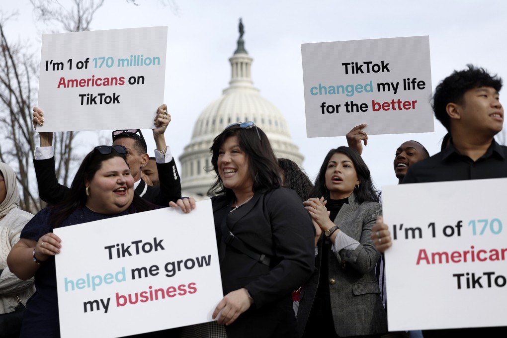Participants hold signs in support of TikTok outside the US Capitol building on March 13 in Washington. Photo: Getty Images/TNS