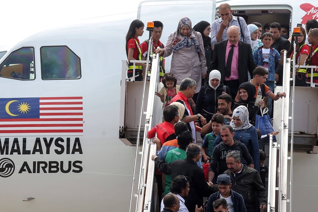 Syrian refugees arrive in Malaysia in 2016. Photo: AFP