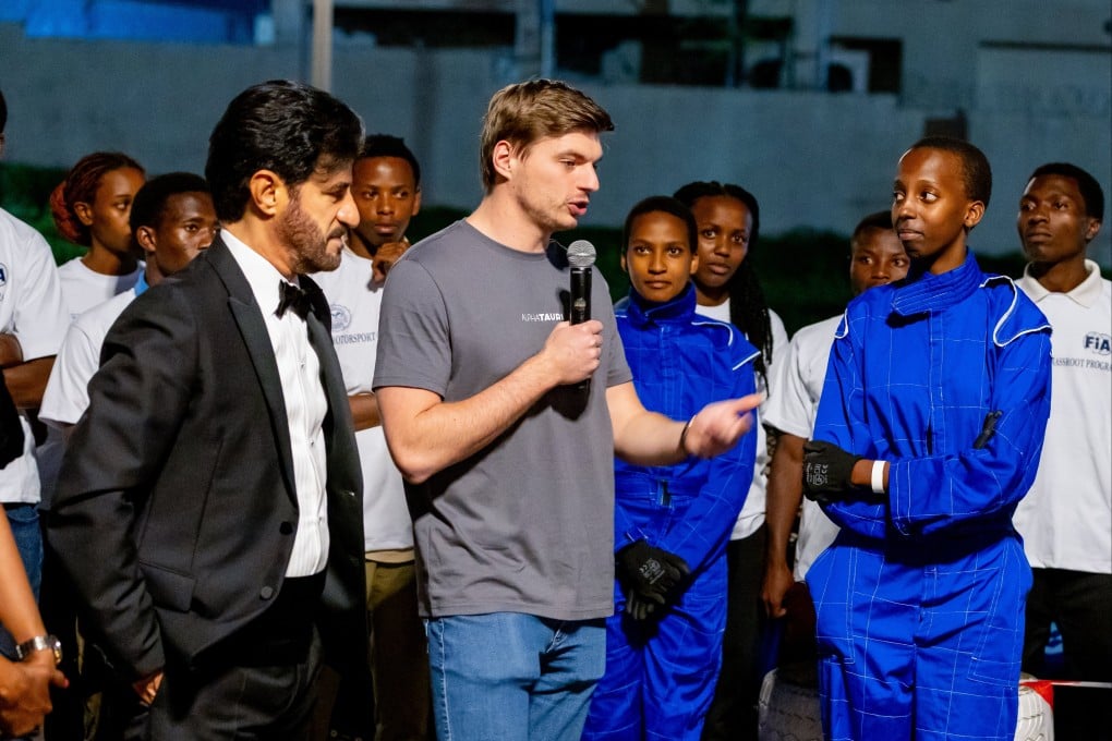 Max Verstappen (centre) doing FIA-mandated community service in Kigali, Rwanda on Friday. The world champion was punished for swearing during a press conference at the Singapore Grand Prix. Photo: EPA-EFE