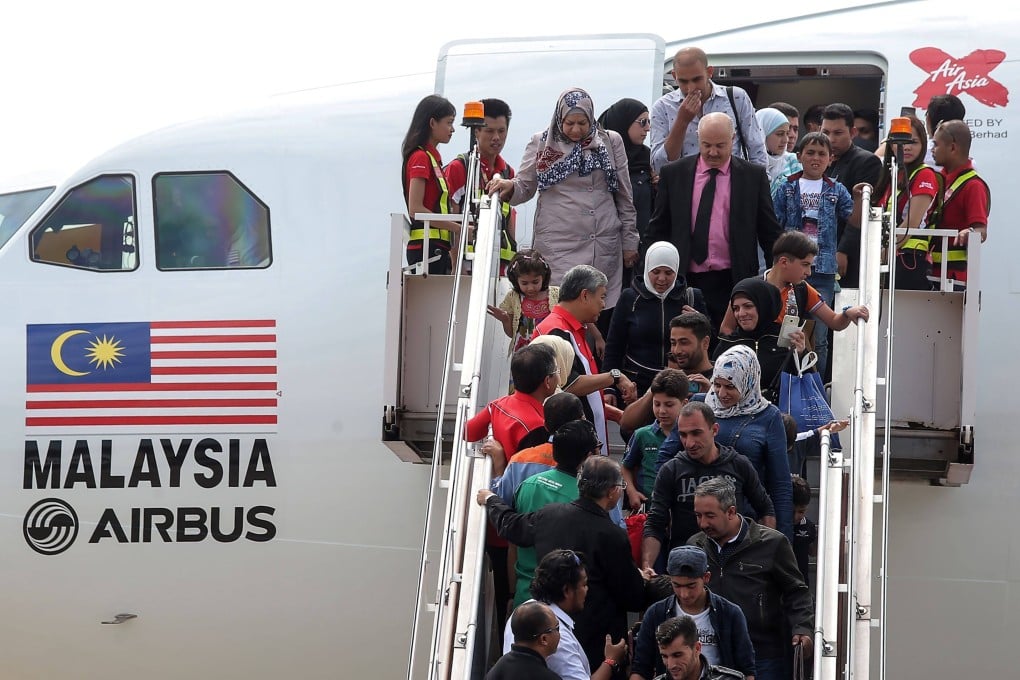 Syrian refugees arrive in Malaysia in 2016. Photo: AFP