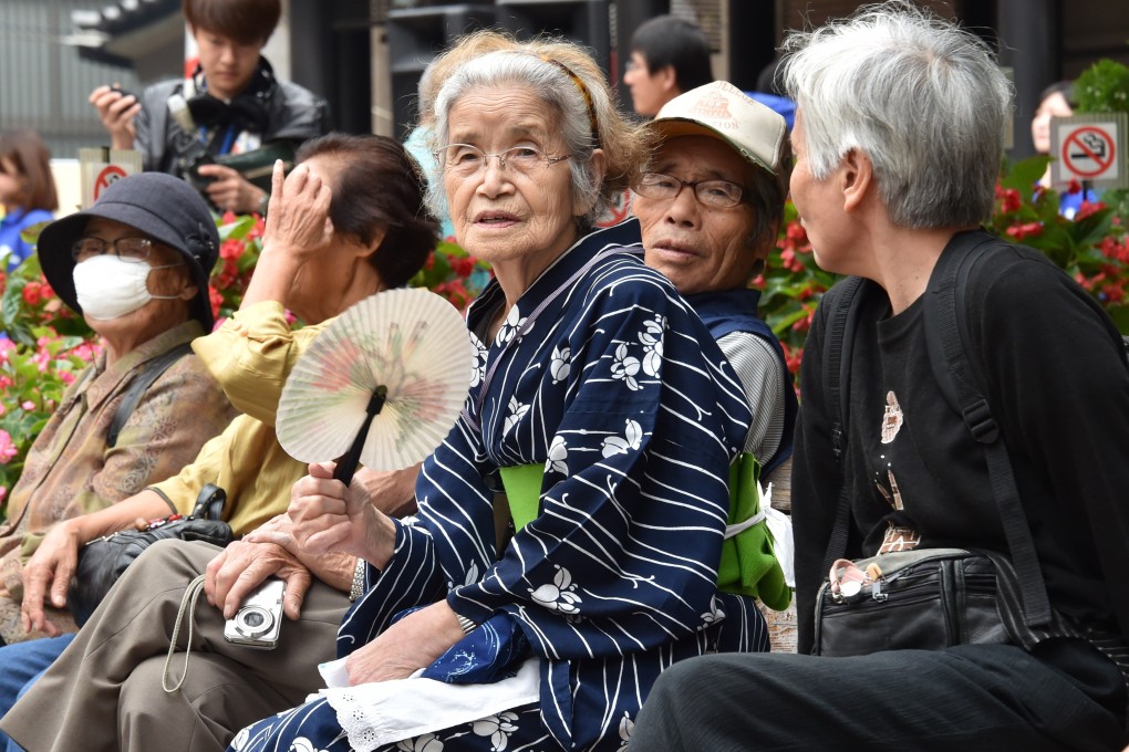 Elderly residents rest in the grounds of a temple in Tokyo in 2014 as the country marks Respect-for-the-Aged-Day. Photo: AFP