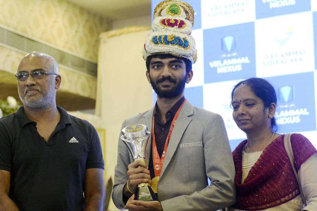 World chess champion Gukesh Dommaraju, his father Rajinikanth, and his mother Padmavathi at a ceremony in Chennai on his return from Singapore on Monday. Photo: AP