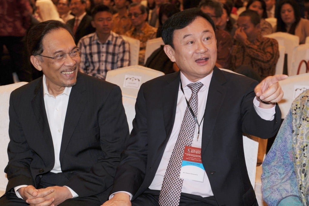 Malaysia’s Anwar Ibrahim (left) with Thaksin Shinawatra at an event in Jakarta in 2012. Photo: AFP