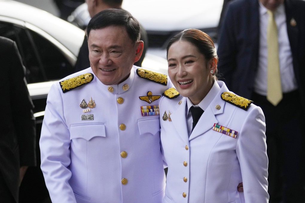 Thailand’s former Prime Minister Thaksin Shinawatra, left, and his daughter and PM Paetongtarn Shinawatra arrive before the royal endorsement ceremony in Bangkok in August. Photo: AP