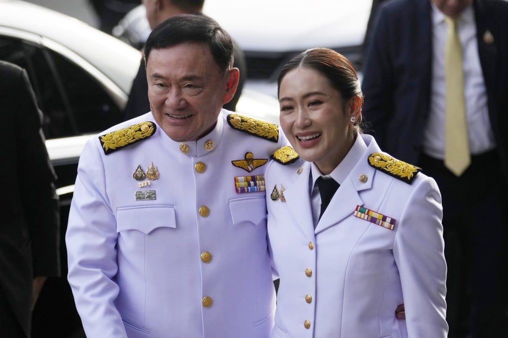 Thailand’s former Prime Minister Thaksin Shinawatra, left, and his daughter and PM Paetongtarn Shinawatra arrive before the royal endorsement ceremony in Bangkok in August. Photo: AP